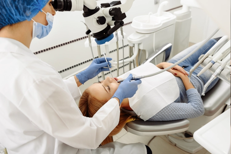 • Dentist performing periodontal surgery in Surrey