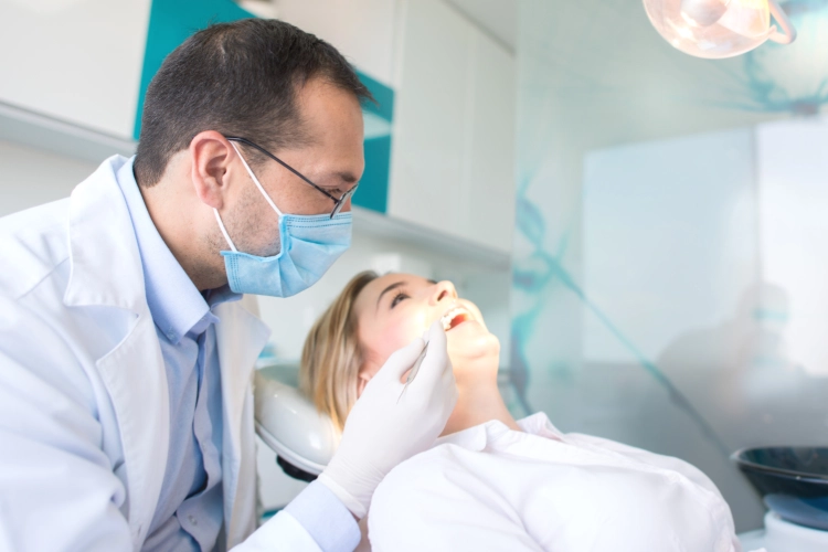 Dental hygienist performing cleaning at Heavenly Dental Surrey. Preventive Dentistry Surrey