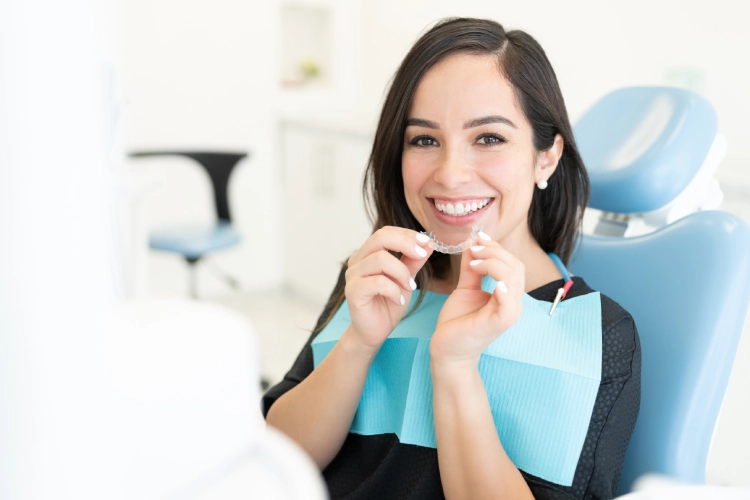 • Patient reviewing Invisalign treatment plan at Heavenly Dental Surrey